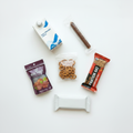 The Champion Pack snacks flat lay